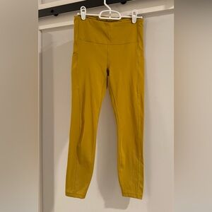 Athleta - Stash Pocket  7/8 tights Mustard Yellow Stretch Leggings